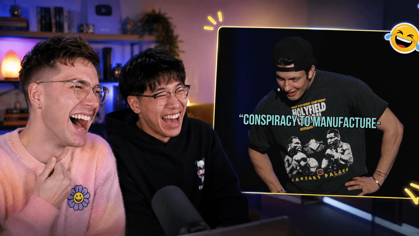 Two creators laughing while reacting to a live comedy performance