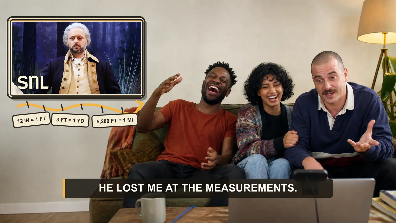 Two creators laughing while reacting to a live comedy performance